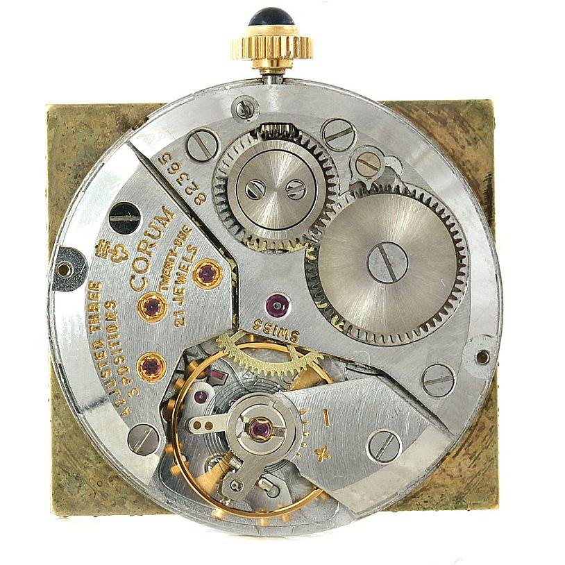 This image shows the internal mechanism and components of a Vintage Corum watch from a top-down angle.