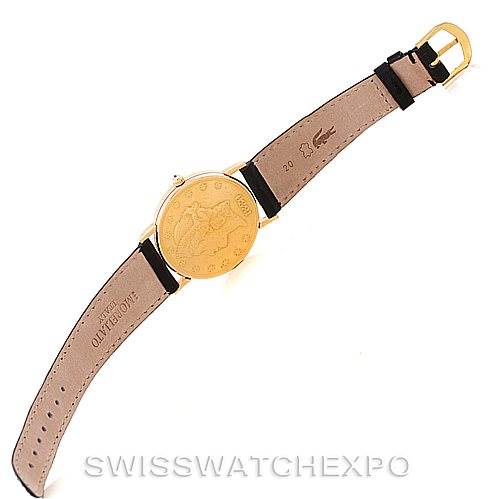 The image shows the back view of the Vintage Corum watch, highlighting the strap, buckle, and engraved case back.