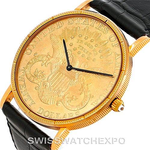 This image shows a close-up, angled view of the face and crown of a Vintage Corum watch.