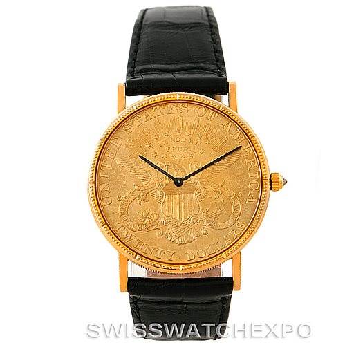 The image displays a front view of the Vintage Corum watch, featuring a gold coin dial and a black leather strap.