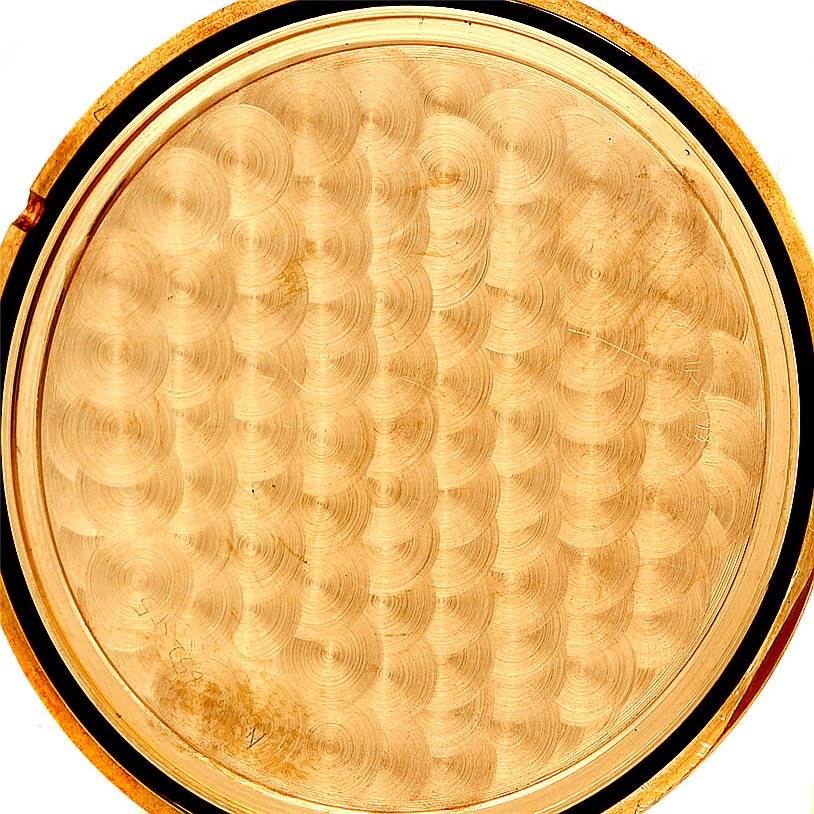 This image shows a close-up of the dial back of a Corum Coin Watch Men's Yellow Gold Black Dial Men's Yellow Gold Black Dial model.