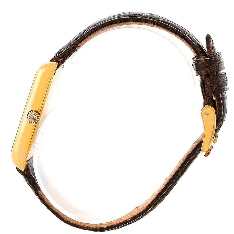 The image shows a side view of the Corum 42456 Women's Yellow Gold Champagne Dial 42456 Women's Yellow Gold Champagne Dial 18K Yellow Gold Diamond 5 Gram Ingot 999.9 Watch, highlighting the case and leather strap.