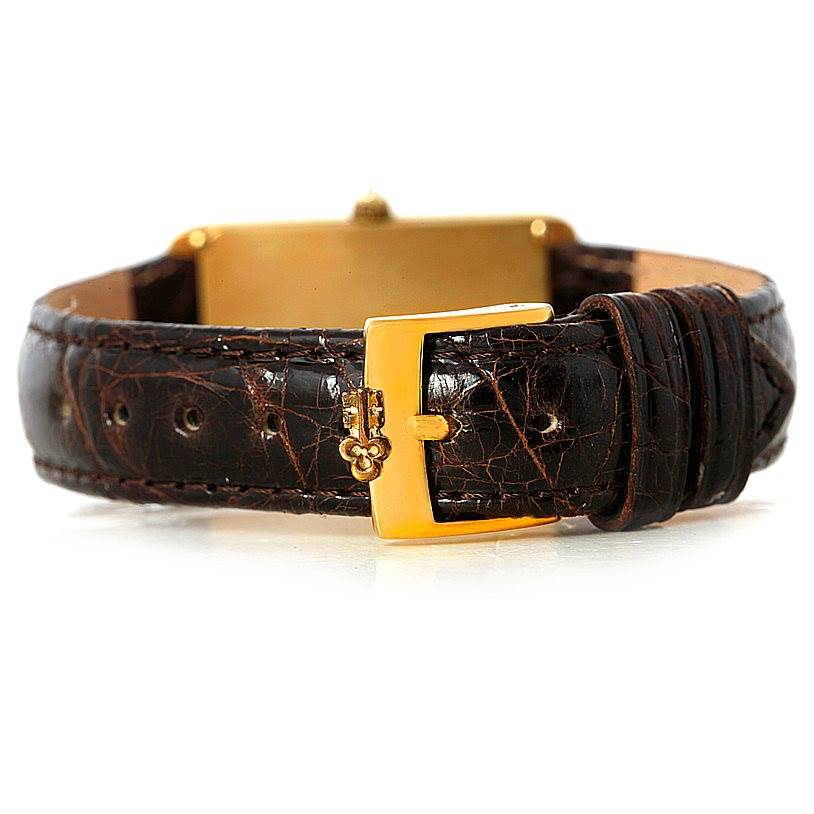 The image shows the buckle and a section of the strap in focus, highlighting the Corum 42456 Women's Yellow Gold Champagne Dial 42456 Women's Yellow Gold Champagne Dial 18K Yellow Gold Diamond 5 Gram Ingot 999.9 Watch.