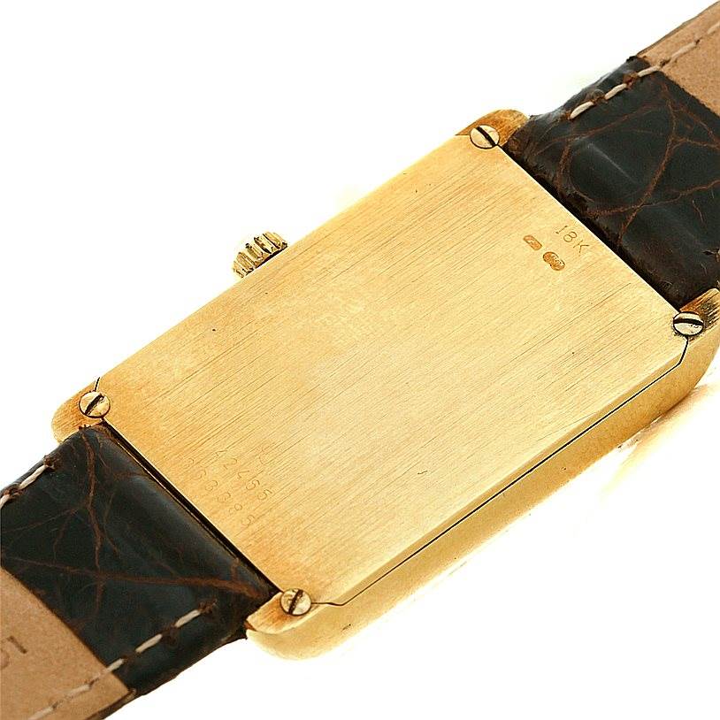This image shows the back of the Corum 42456 Women's Yellow Gold Champagne Dial 42456 Women's Yellow Gold Champagne Dial 18K Yellow Gold Diamond 5 Gram Ingot 999.9 Watch, including the leather strap and back plate.