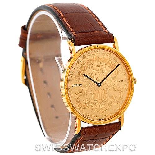 The image shows a Coin Watch model by Corum at a three-quarter angle, highlighting the face, bezel, and brown leather strap.