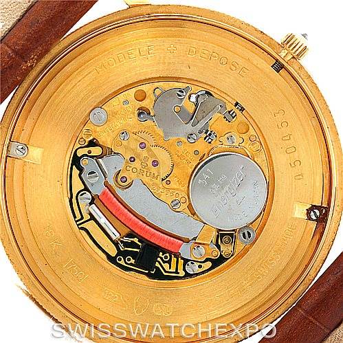 This image shows the back view of a Corum Coin Watch Men's Yellow Gold Black Dial Men's Yellow Gold Black Dial model, highlighting its internal mechanism and components.