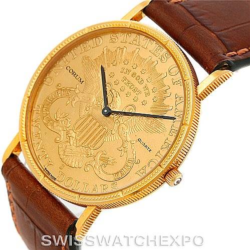This image shows a Corum Coin Watch Men's Yellow Gold Black Dial Men's Yellow Gold Black Dial model from an angled top view, highlighting its gold coin face, leather strap, and crown.