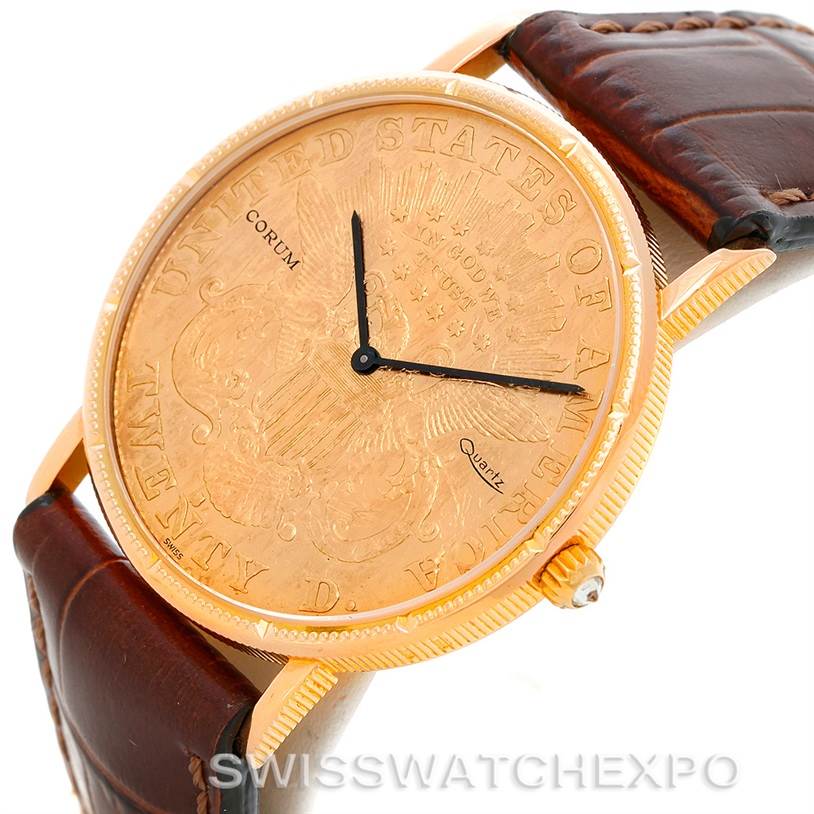 The Coin Watch model by Corum is shown at an angle highlighting the gold coin dial, leather strap, and crown.