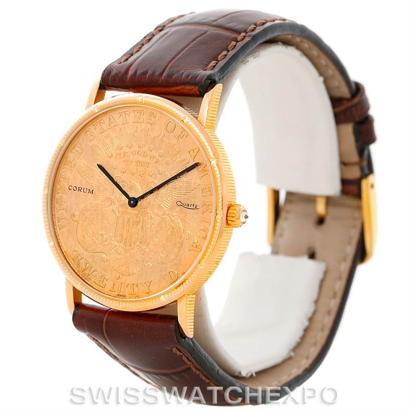 The Corum Coin Watch Men's Yellow Gold Black Dial Men's Yellow Gold Black Dial is shown at a slightly angled side view, highlighting its gold-tone face, black hands, and brown leather strap.