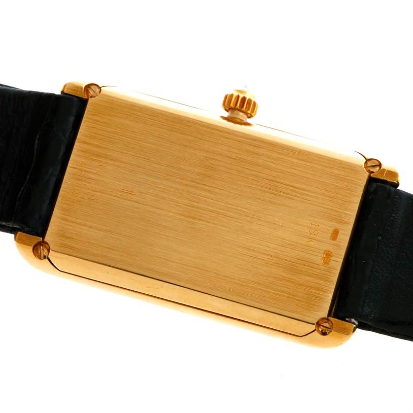 This image shows the back of the Corum Women's Yellow Gold Champagne Dial Women's Yellow Gold Champagne Dial 18K Yellow Gold 10 Gram Ingot 999.9 Mechanical Ladies Watch, highlighting the case and crown.