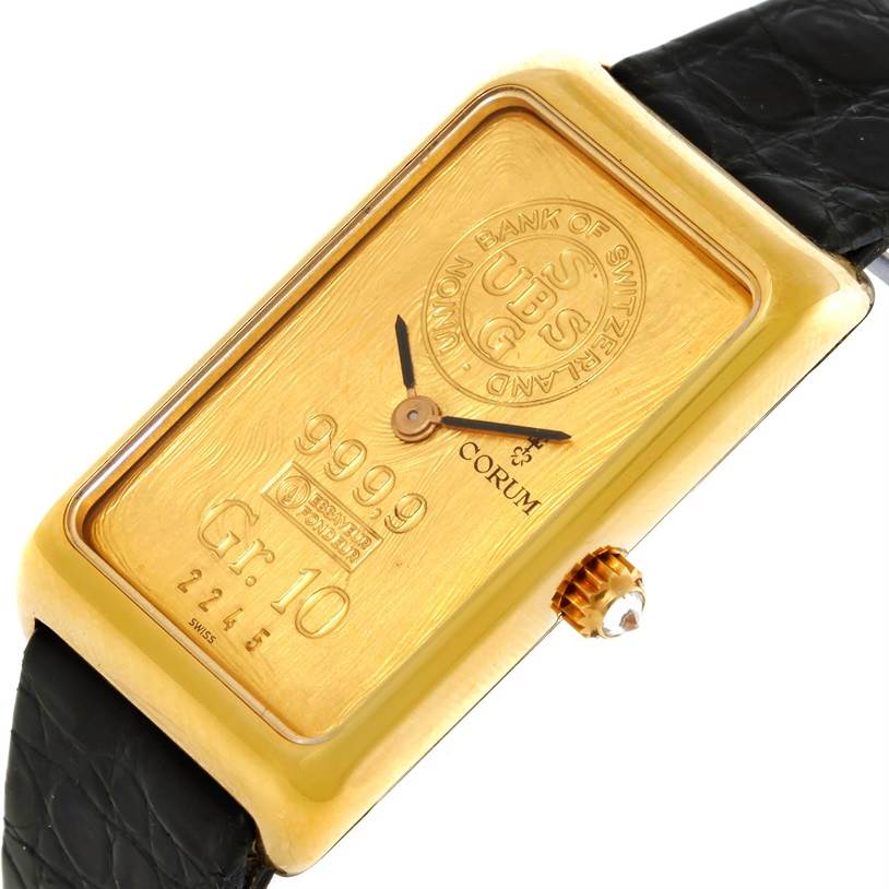 The Corum Women's Yellow Gold Champagne Dial Women's Yellow Gold Champagne Dial 18K Yellow Gold 10 Gram Ingot 999.9 Mechanical Ladies Watch is shown from a top angle, highlighting the face and crown.