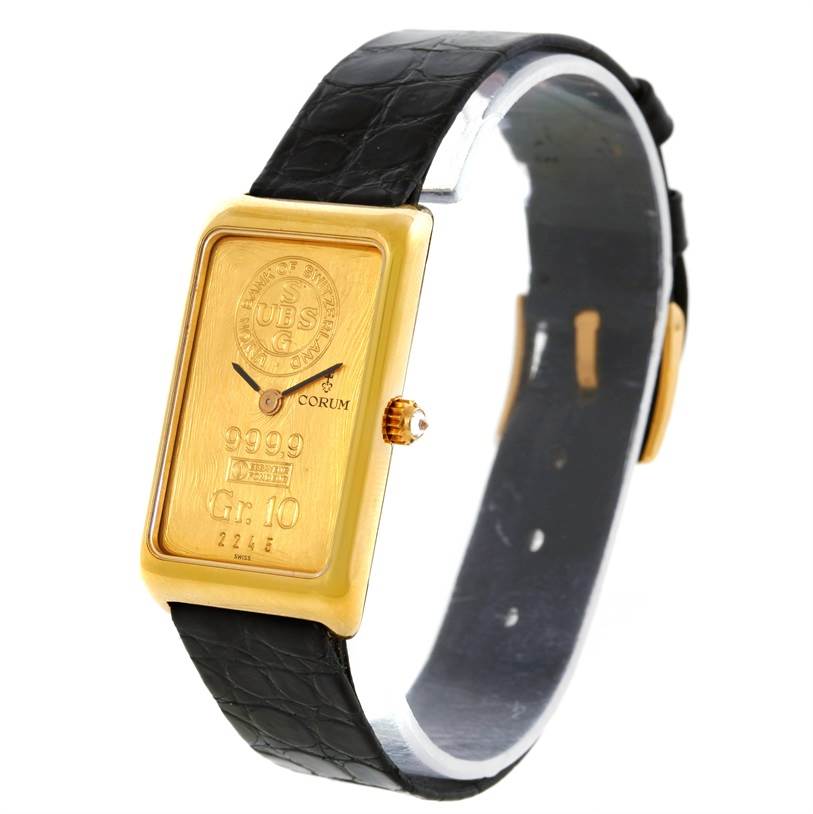 The Corum Women's Yellow Gold Champagne Dial Women's Yellow Gold Champagne Dial 18K Yellow Gold 10 Gram Ingot 999.9 Mechanical Ladies Watch is shown at an angle displaying the face and strap.