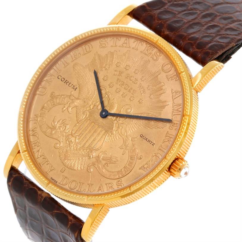 The image shows a Corum Coin Watch Men's Yellow Gold Black Dial Men's Yellow Gold Black Dial model at a slight angle, detailing the dial, bezel, crown, and brown leather strap.
