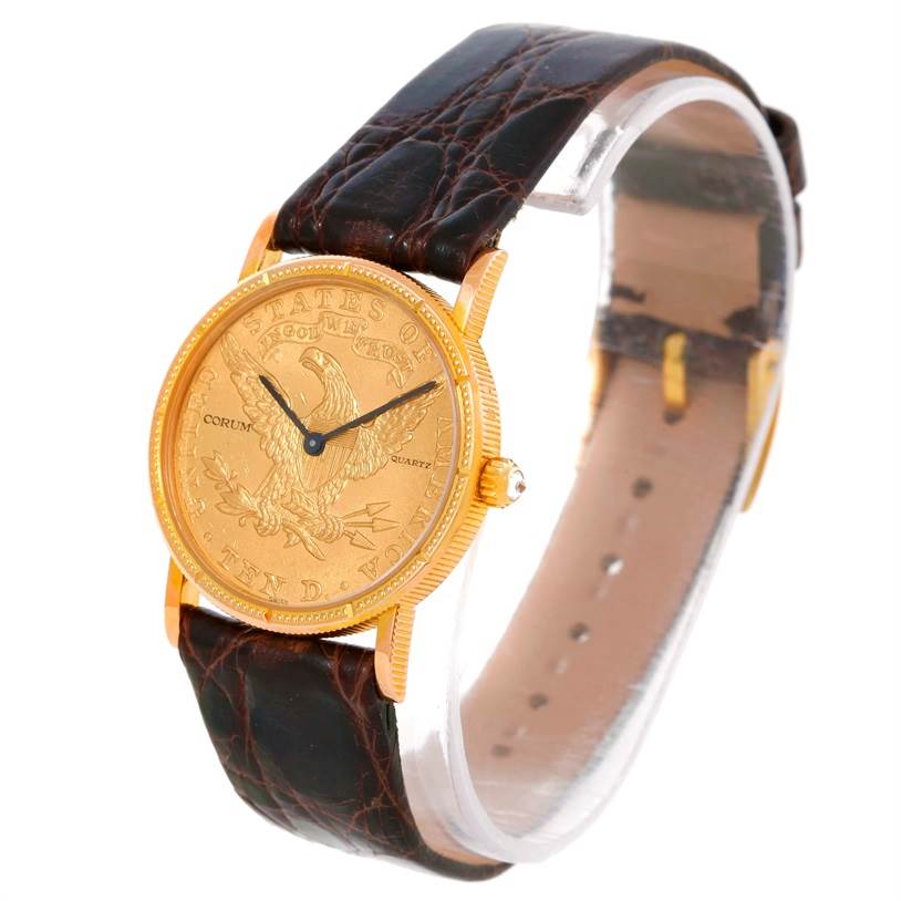 The image shows a front angled view of the Corum Women's Yellow Gold Black Dial Women's Yellow Gold Black Dial 22K Yellow Gold 10 Dollars Coin Diamond Ladies Watch, displaying the face and leather strap.