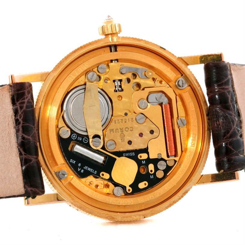 This image shows the back view and internal mechanism of the Corum Women's Yellow Gold Black Dial Women's Yellow Gold Black Dial 22K Yellow Gold 10 Dollars Coin Diamond Ladies Watch.