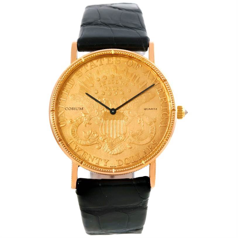 The image shows a front view of the Corum Coin Watch Men's Yellow Gold Black Dial Men's Yellow Gold Black Dial model, highlighting its gold coin dial, black leather strap, and crown.
