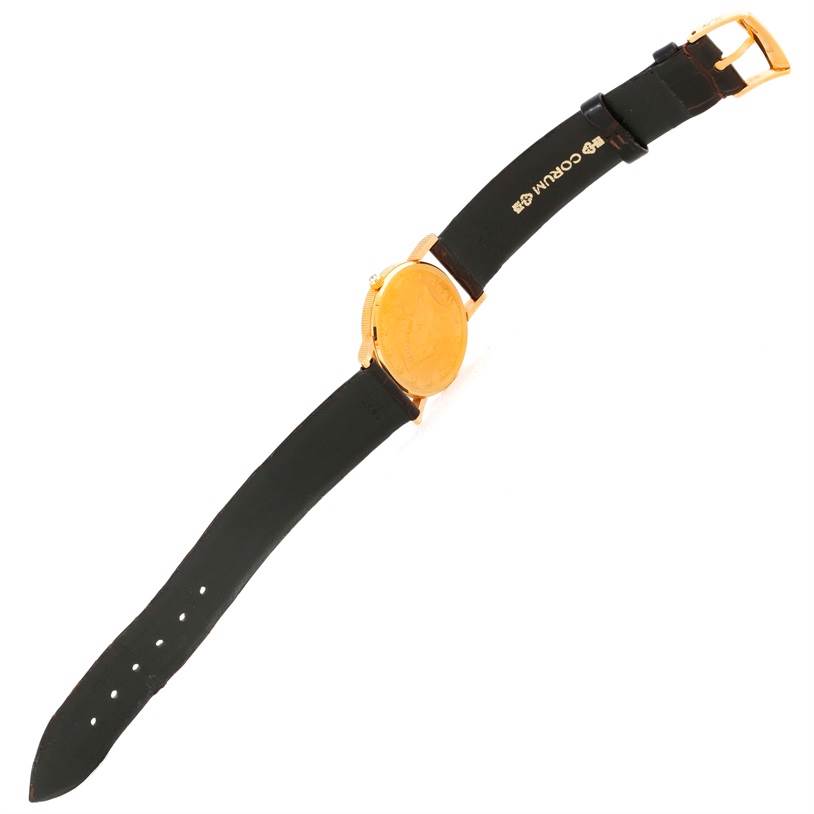 The image shows the Corum Women's  Women's  18K Yellow Gold 10 Dollars Coin Diamond Ladies Watch Unworn model from the back, displaying its strap and clasp.