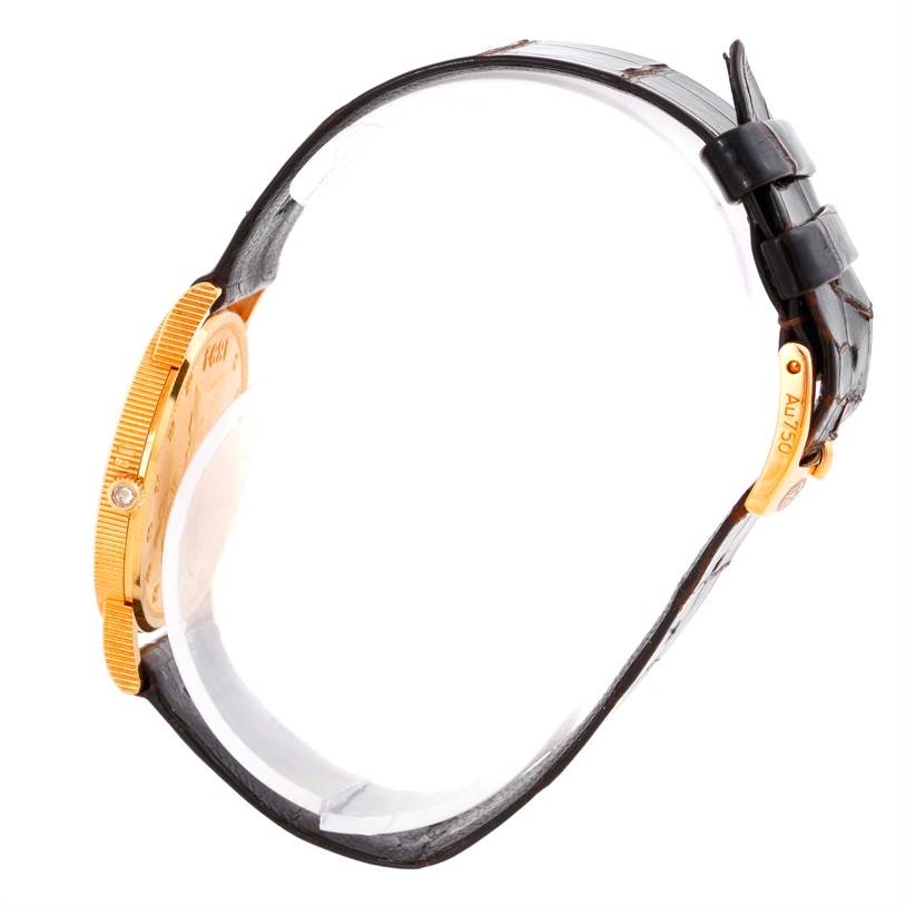 The image shows a side view of the Corum Women's  Women's  18K Yellow Gold 10 Dollars Coin Diamond Ladies Watch Unworn model, highlighting its strap and buckle.