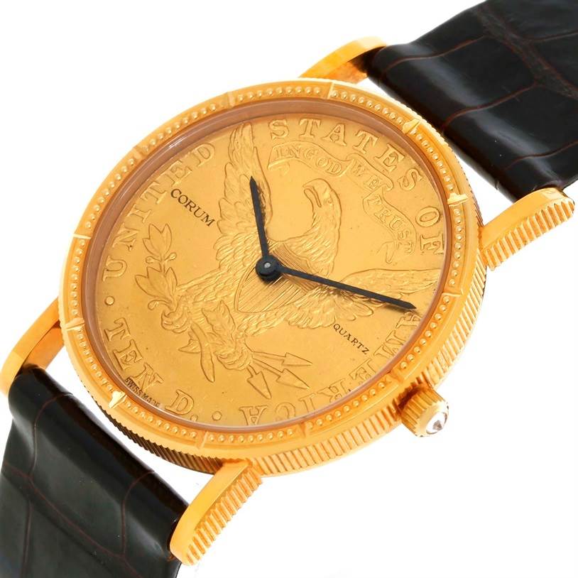 This image shows a close-up, angled view of the Corum Women's  Women's  18K Yellow Gold 10 Dollars Coin Diamond Ladies Watch, highlighting its face, bezel, and part of the strap.