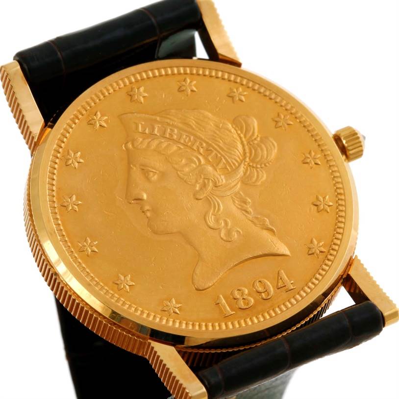 The image shows a close-up of the face and bezel of the Corum Women's  Women's  18K Yellow Gold 10 Dollars Coin Diamond Ladies Watch Unworn model, angled slightly to the right.