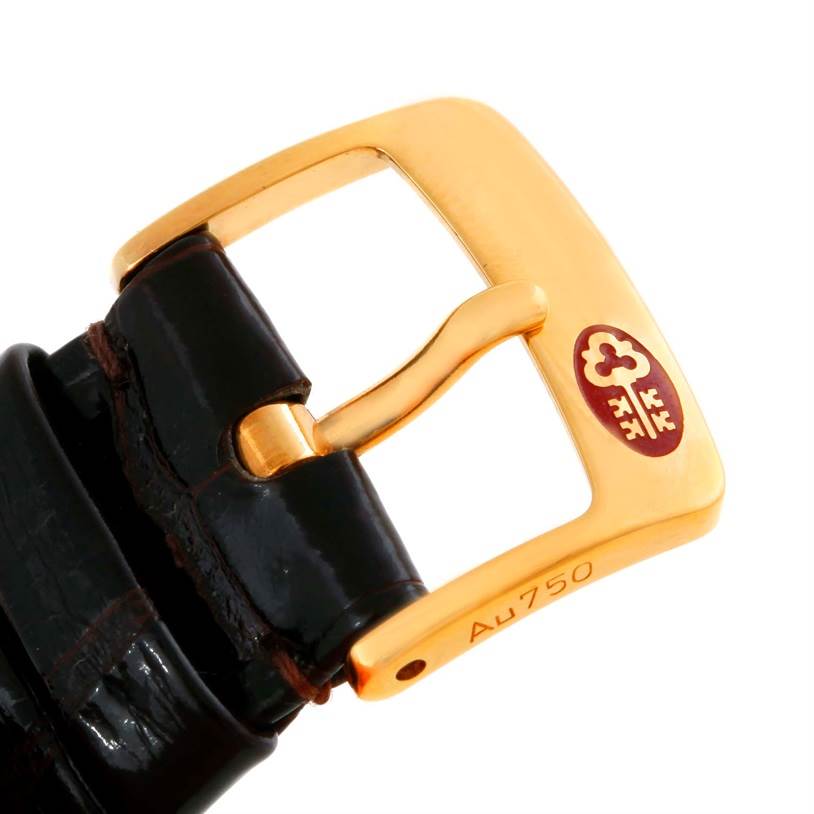 This image shows a close-up of the buckle of a Corum Women's  Women's  18K Yellow Gold 10 Dollars Coin Diamond Ladies Watch Unworn model.