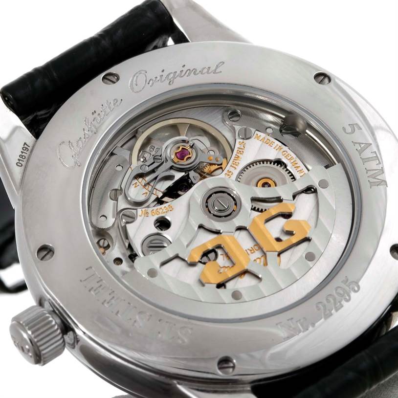 The image shows the back of a Glashütte Senator model watch, highlighting its intricate movement and internal mechanisms.