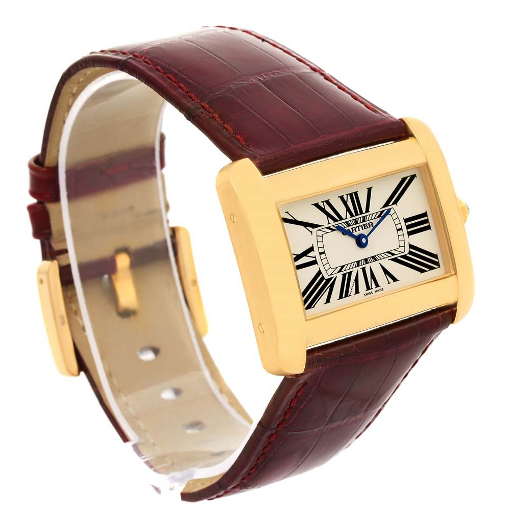 The Cartier Tank Divan W6300556? Yellow Gold Silver Dial W6300556? Yellow Gold Silver Dial watch is shown at an angled view featuring its gold case, Roman numeral dial, and brown leather strap.