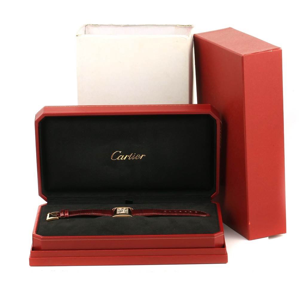 The Cartier Tank Divan W6300556? Yellow Gold Silver Dial W6300556? Yellow Gold Silver Dial watch is displayed in an open red box, showing the strap and face from a front angle.