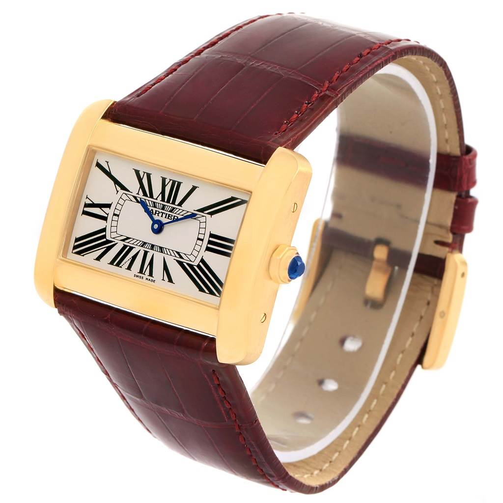 This image shows a Cartier Tank Divan W6300556? Yellow Gold Silver Dial W6300556? Yellow Gold Silver Dial watch angled to display the face, crown, and part of the leather strap.