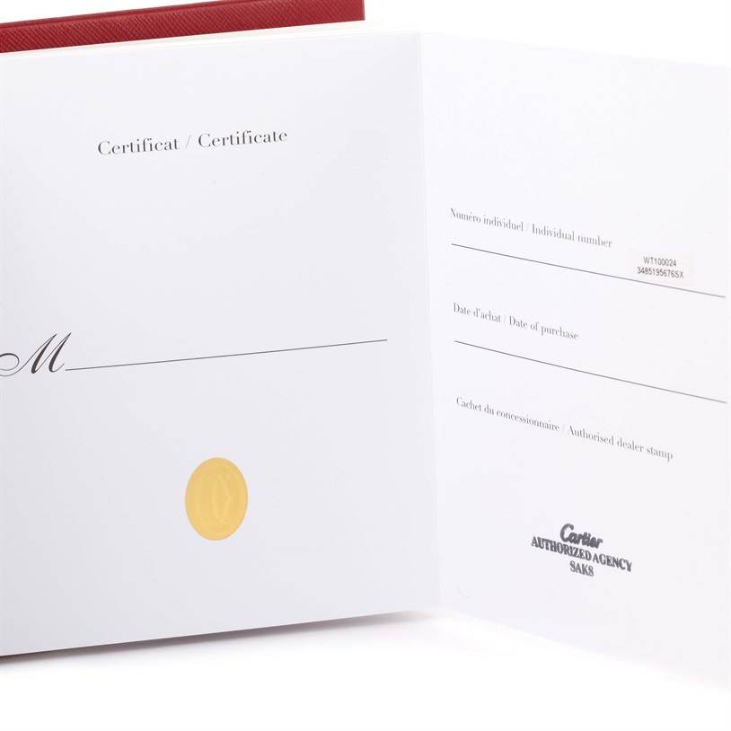 The image shows an opened booklet of authenticity and warranty documentation for the Cartier Tank Anglaise WT100024 Women's Steel and Gold (two tone) Silver Dial WT100024 Women's Steel and Gold (two tone) Silver Dial watch.