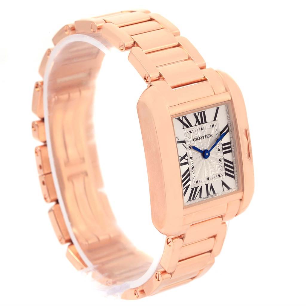The Cartier Tank Anglaise W5310013 Women's Rose Gold Silver Dial W5310013 Women's Rose Gold Silver Dial watch is shown from a front angle, displaying its rectangular face and rose gold bracelet.