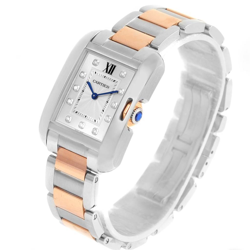This image shows a Cartier Tank Anglaise WT100032 Women's Steel and Gold (two tone) Silver Dial WT100032 Women's Steel and Gold (two tone) Silver Dial watch at an angled view, highlighting its face, bezel, crown, and two-tone metal bracelet.