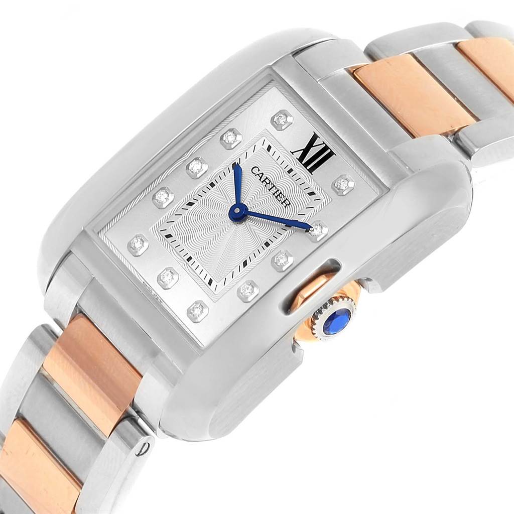 This image shows a close-up angle of the Cartier Tank Anglaise WT100032 Women's Steel and Gold (two tone) Silver Dial WT100032 Women's Steel and Gold (two tone) Silver Dial watch, highlighting its face, crown, and part of the bracelet.