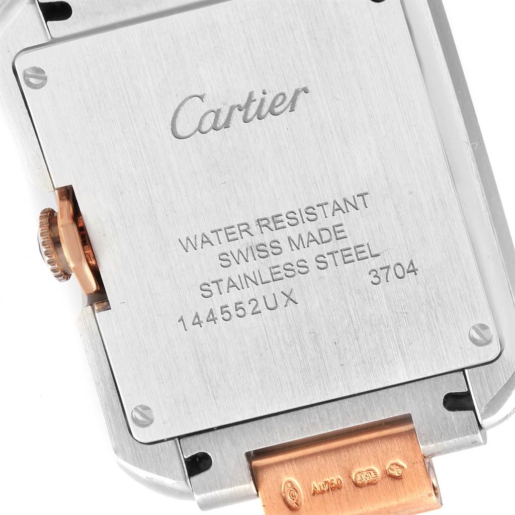 This image shows the back of the Cartier Tank Anglaise WT100032 Women's Steel and Gold (two tone) Silver Dial WT100032 Women's Steel and Gold (two tone) Silver Dial watch, highlighting its engravings and the crown on the side.
