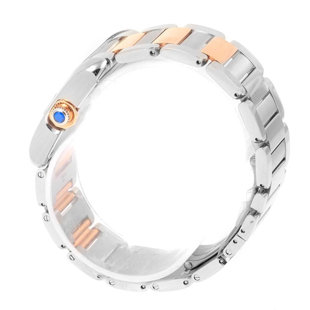 This image shows a side view of the Cartier Tank Anglaise WT100032 Women's Steel and Gold (two tone) Silver Dial WT100032 Women's Steel and Gold (two tone) Silver Dial watch with a focus on the bracelet and crown.