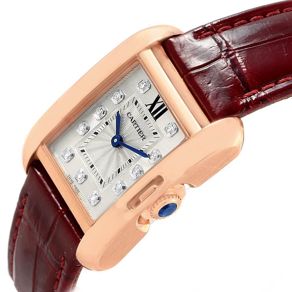 The image shows a side-angle view of a Cartier Tank Anglaise WJTA0007 Women's Rose Gold Silver Dial WJTA0007 Women's Rose Gold Silver Dial watch, highlighting its face, crown, and leather strap.
