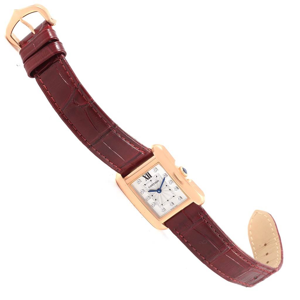 The Cartier Tank Anglaise WJTA0007 Women's Rose Gold Silver Dial WJTA0007 Women's Rose Gold Silver Dial watch is shown angled diagonally, displaying the face, strap, buckle, and a side view of the case.