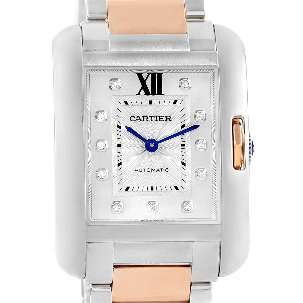 The image shows a frontal view of the Cartier Tank Anglaise WT100034 Steel and Gold (two tone) Silver Dial WT100034 Steel and Gold (two tone) Silver Dial watch, highlighting its face, hands, and part of the band.