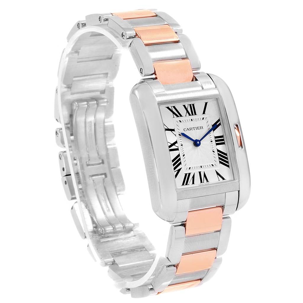The image shows a Cartier Tank Anglaise WT100032 Women's Steel and Gold (two tone) Silver Dial WT100032 Women's Steel and Gold (two tone) Silver Dial watch angled to display its face and two-tone metal bracelet.