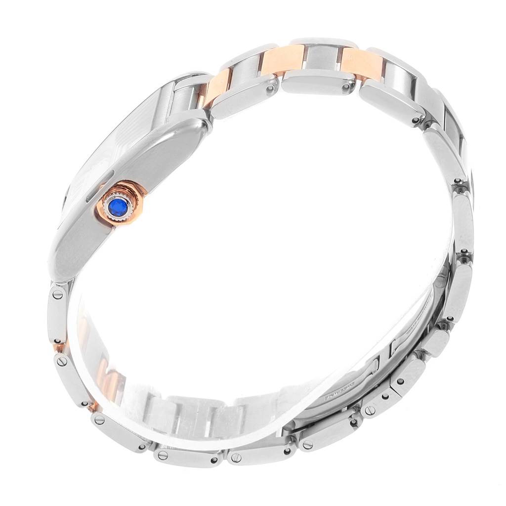 The image shows a side view of a Cartier Tank Anglaise WT100032 Women's Steel and Gold (two tone) Silver Dial WT100032 Women's Steel and Gold (two tone) Silver Dial watch highlighting its metal bracelet and crown.