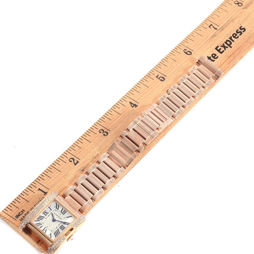 This Cartier Tank Anglaise WT100002 Women's Rose Gold Silver Dial WT100002 Women's Rose Gold Silver Dial watch is shown from a top-down angle, with the watch face, case, and full bracelet visible alongside a ruler.