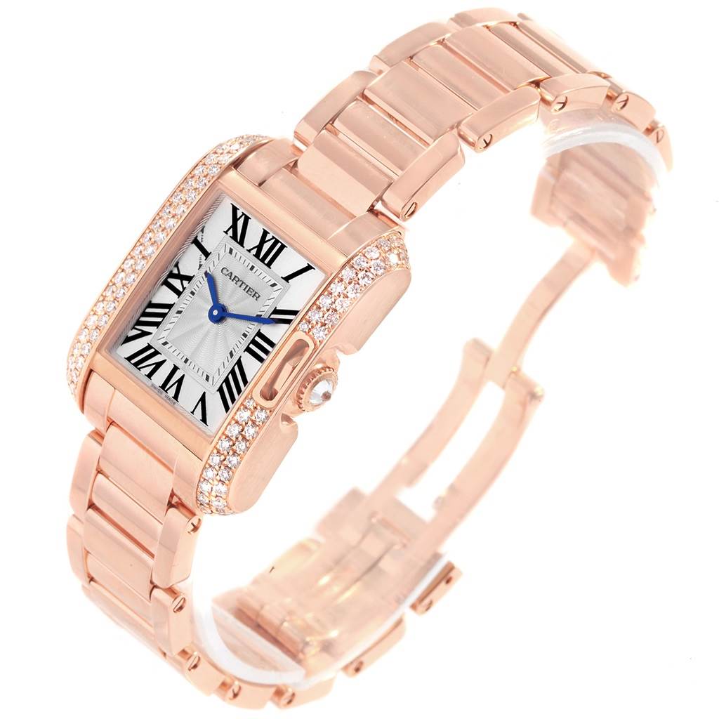 The Cartier Tank Anglaise WT100002 Women's Rose Gold Silver Dial WT100002 Women's Rose Gold Silver Dial watch is shown at an oblique angle with a clear view of the face and the gold bracelet.