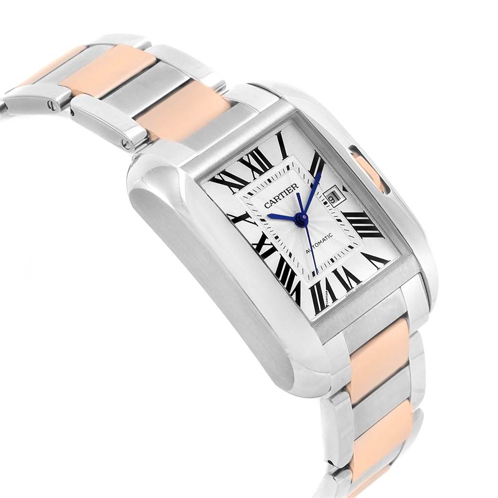 The image shows a Cartier Tank Anglaise W5310007 Men
s Steel and Gold (two tone) Silver Dial W5310007 Men
s Steel and Gold (two tone) Silver Dial watch at an angle highlighting its face, bezel, crown, and two-tone bracelet.