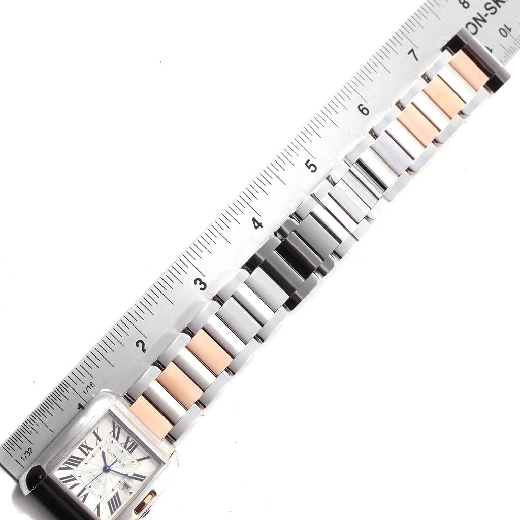 The image shows the strap and face of a Cartier Tank Anglaise W5310007 Men
s Steel and Gold (two tone) Silver Dial W5310007 Men
s Steel and Gold (two tone) Silver Dial watch, aligned next to a ruler for measurement.