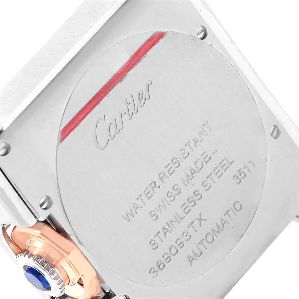 The image shows the back case and crown of the Cartier Tank Anglaise W5310007 Men
s Steel and Gold (two tone) Silver Dial W5310007 Men
s Steel and Gold (two tone) Silver Dial watch, highlighting the brand
s engraving and specifications.