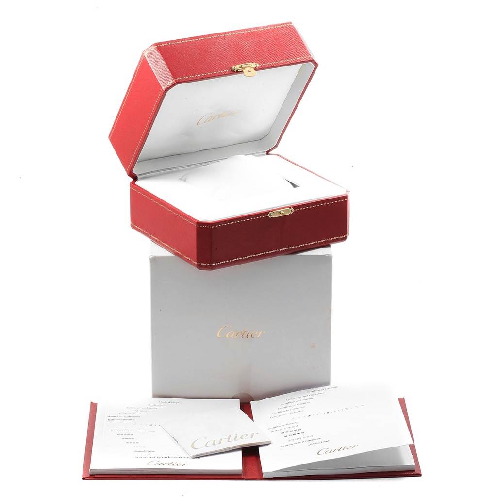 The image shows the opened red Cartier box and accompanying documentation for the Cartier Tank Anglaise W5310007 Men
s Steel and Gold (two tone) Silver Dial W5310007 Men
s Steel and Gold (two tone) Silver Dial model.