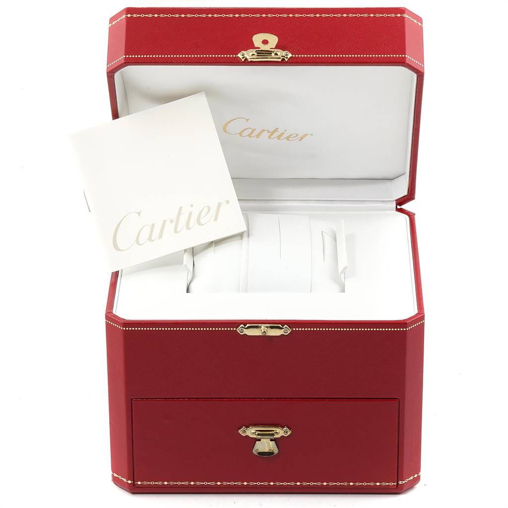 This image shows the open red Cartier box and booklet for the Tank Anglaise model.