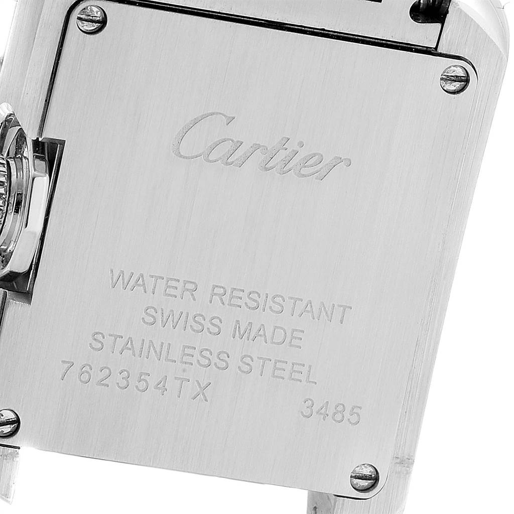 This is the back view of a Cartier Tank Anglaise W5310022 Women's Stainless Steel Silver Dial W5310022 Women's Stainless Steel Silver Dial watch, showcasing the case back with inscriptions and part of the crown.