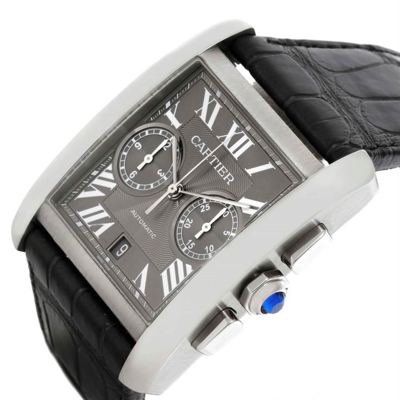 The image shows a Cartier Tank MC W5330008 Men's Stainless Steel Grey Dial W5330008 Men's Stainless Steel Grey Dial watch at an angled view, highlighting its dial, roman numerals, chronograph sub-dials, and black leather strap.
