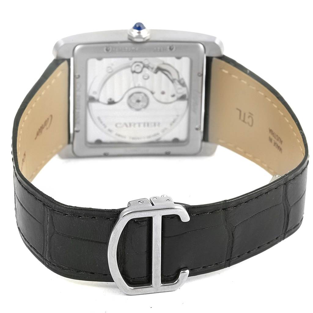 The image shows the Cartier Tank MC W5330004 Men's Stainless Steel Black Dial W5330004 Men's Stainless Steel Black Dial watch from the rear, highlighting the caseback, mechanics, and leather strap with the buckle.